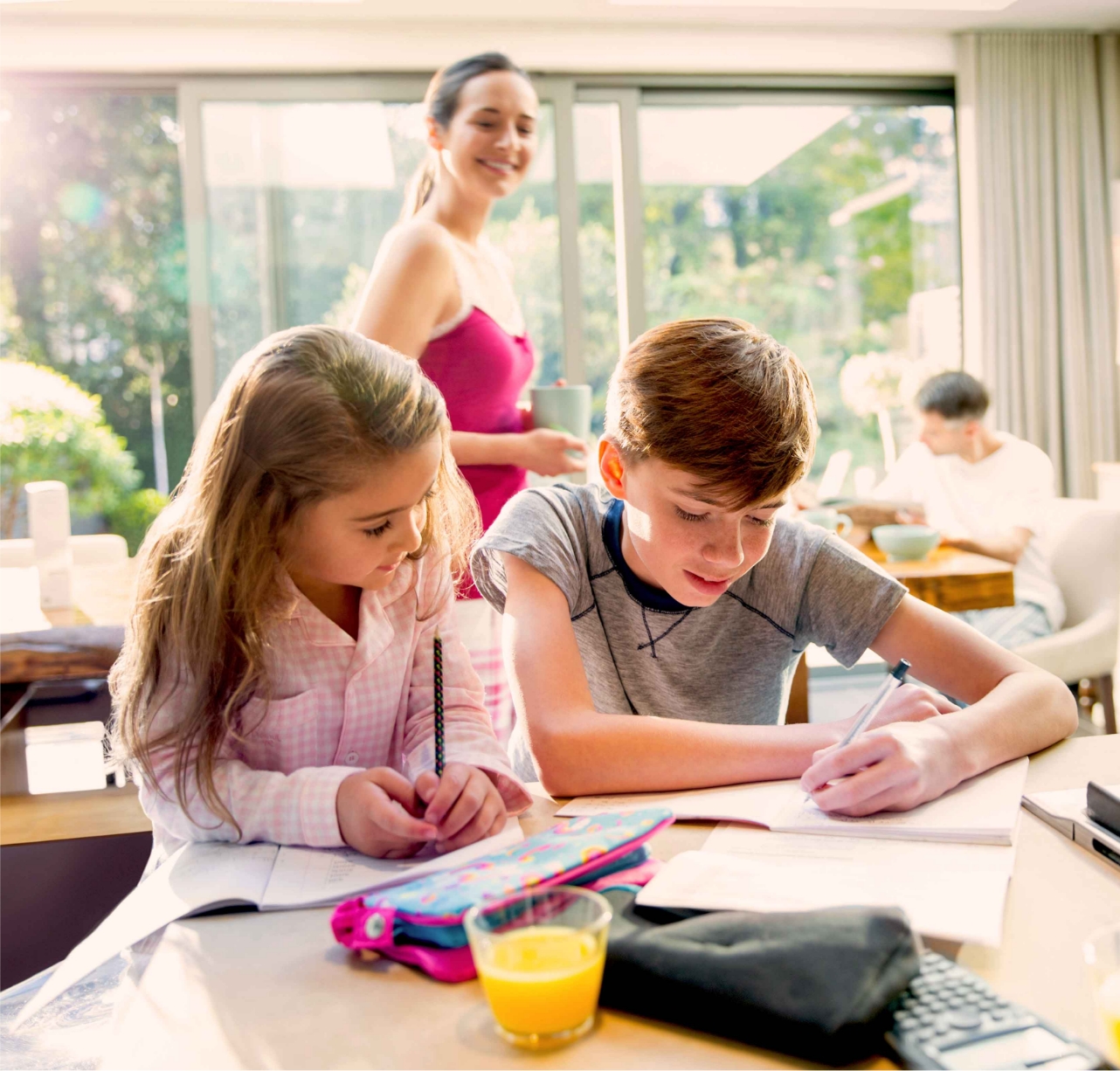 brother and sister doing homework together