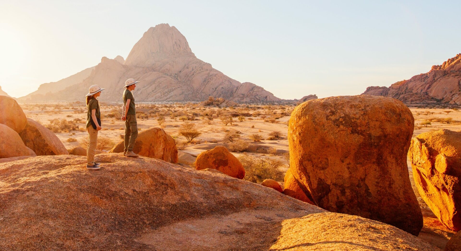 two people exploring the desert