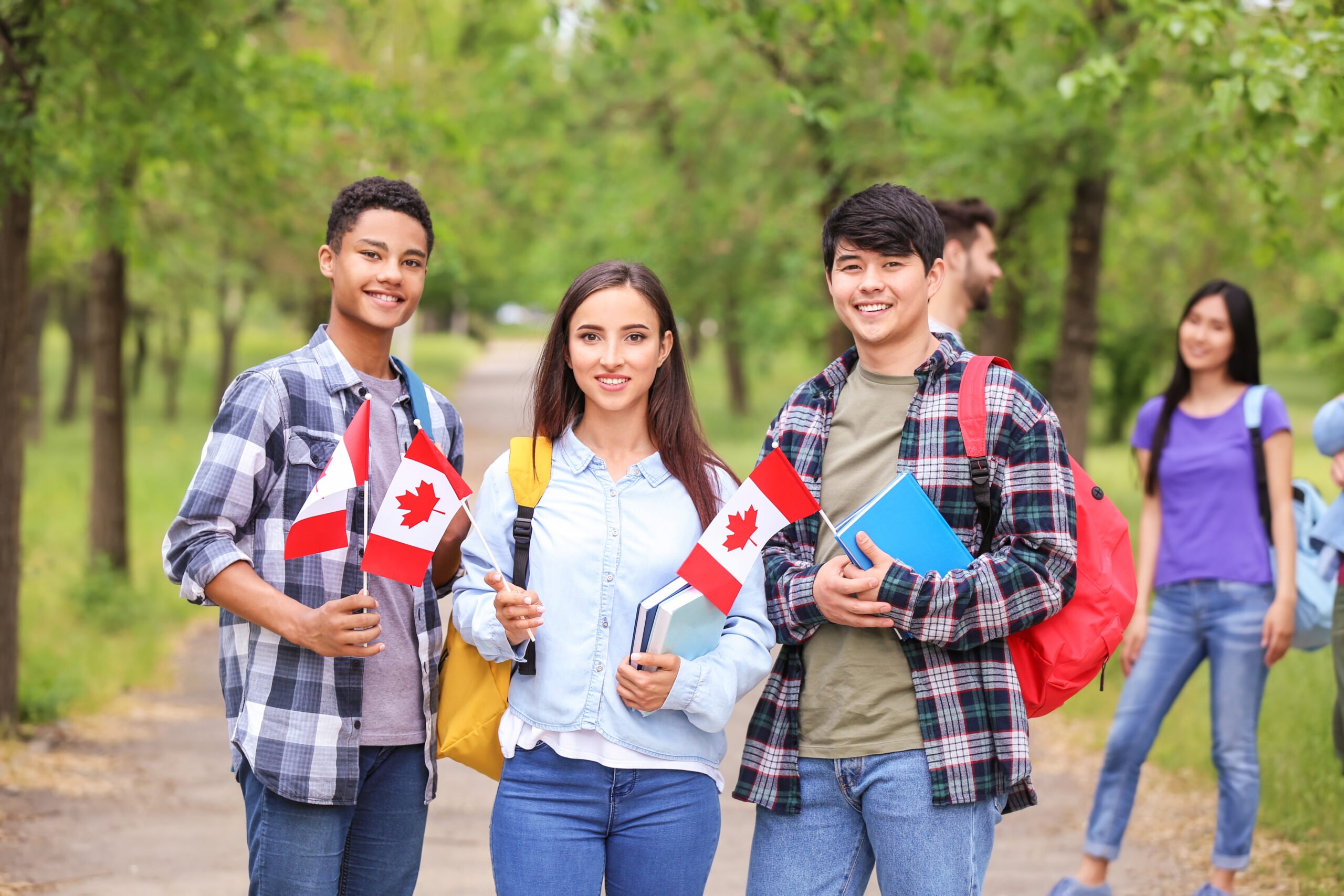 Group of students with Canadian flags outdoors