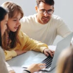 A homeschool student completes school work on a laptop