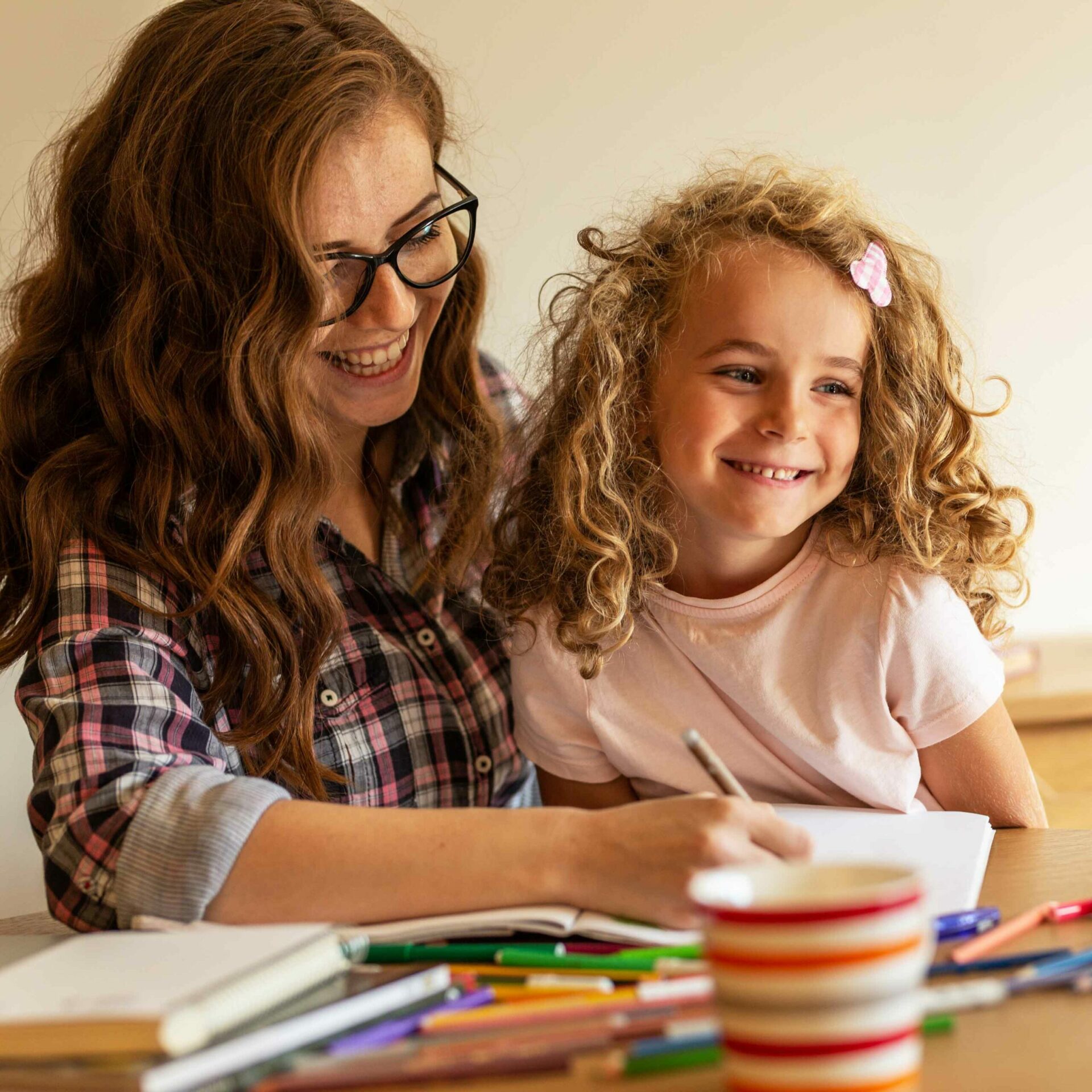 smiling mother and daughter